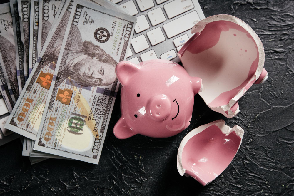 broken-piggy-money-keyboard-concept-cyber-crime-online-fraud-bankruptcy-lost-savings